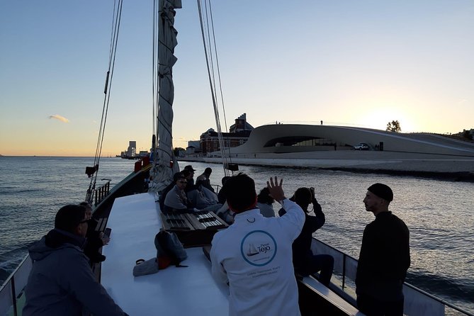 2-Hour Lisbon Traditional Boats Sunset Cruise with White Wine - 25 de Abril Bridge at sunset, plus the best photo spots