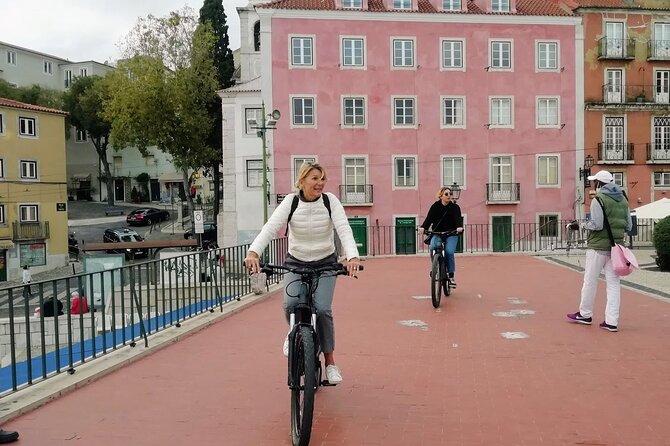 7 Hills and 14 Viewpoints - Lisbon E-Bike Tour - Alfama on an e-bike: labyrinth streets, ginjinha, and church crossings