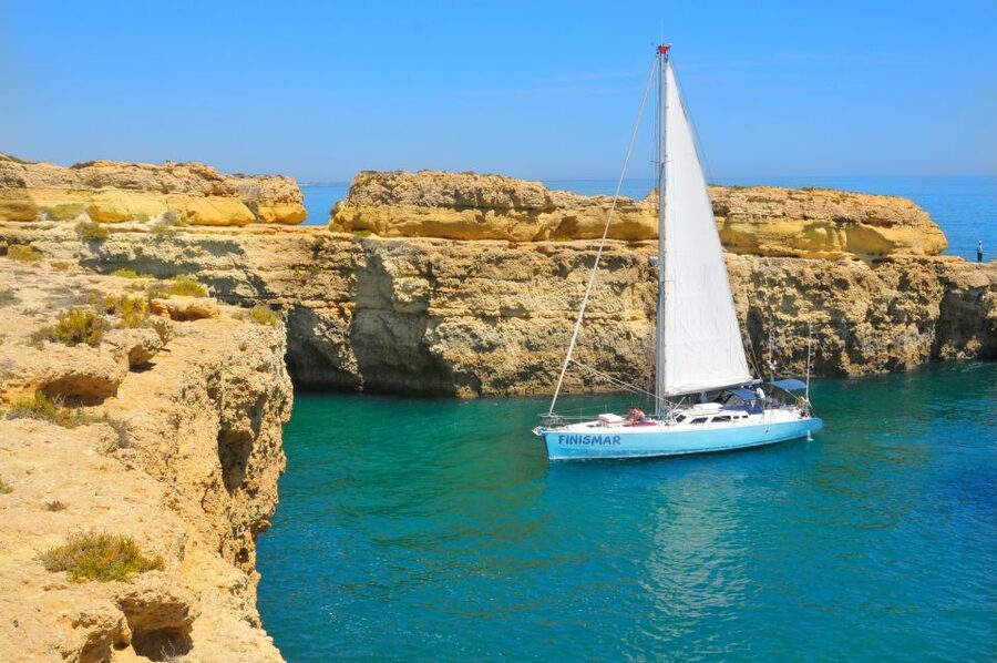 Albufeira: 3-Hour Yacht Daytime/Sunset Cruise to Benagil - Cruising west along the coast, with Benagil Cave and friends in view