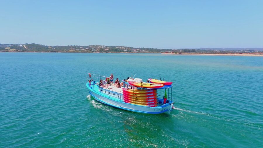 Alvor: Explore Caves Boat and Kayak Tour - Kayaking toward caves and secret beaches near Praia do Vau