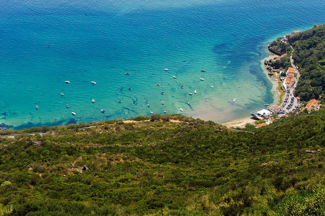 Arrabida and Sesimbra Small-Group Day Trip from Lisbon with Wine Tasting - From Hard Rock Cafe to Vasco da Gama Bridge: the ride that sets the tone