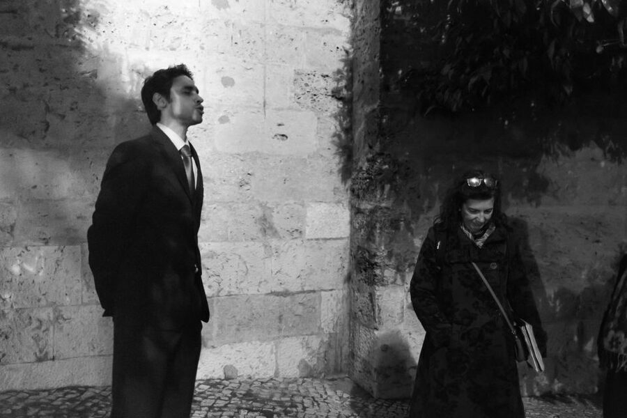 Fado: Musical Walking Tour with Food & Live Show - Mouraria alley walk, with music in the background and the foreground