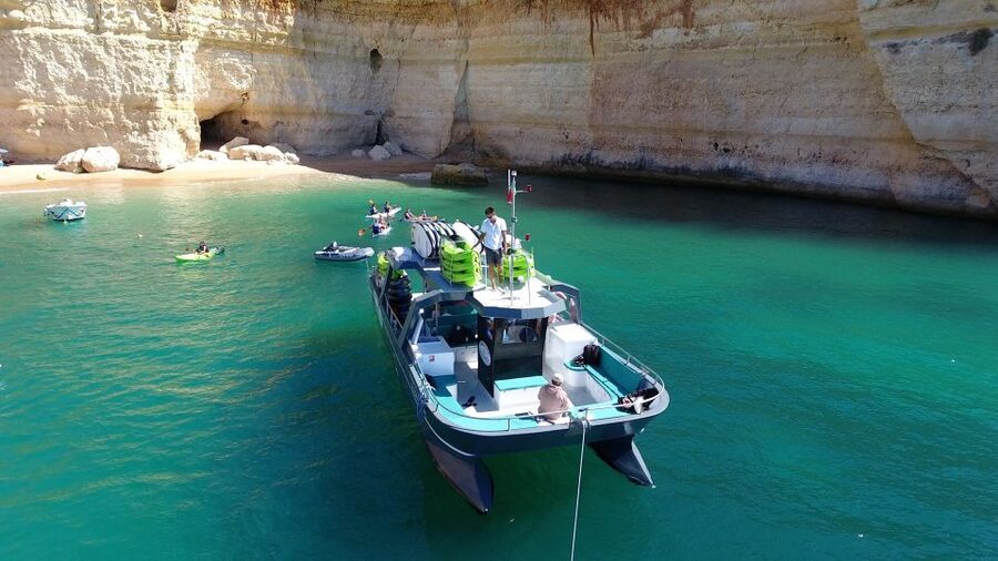 From Albufeira: Benagil Hidden Caves Tour by Kayak - Praia da Marinha kayaking, where the coast feels close and personal