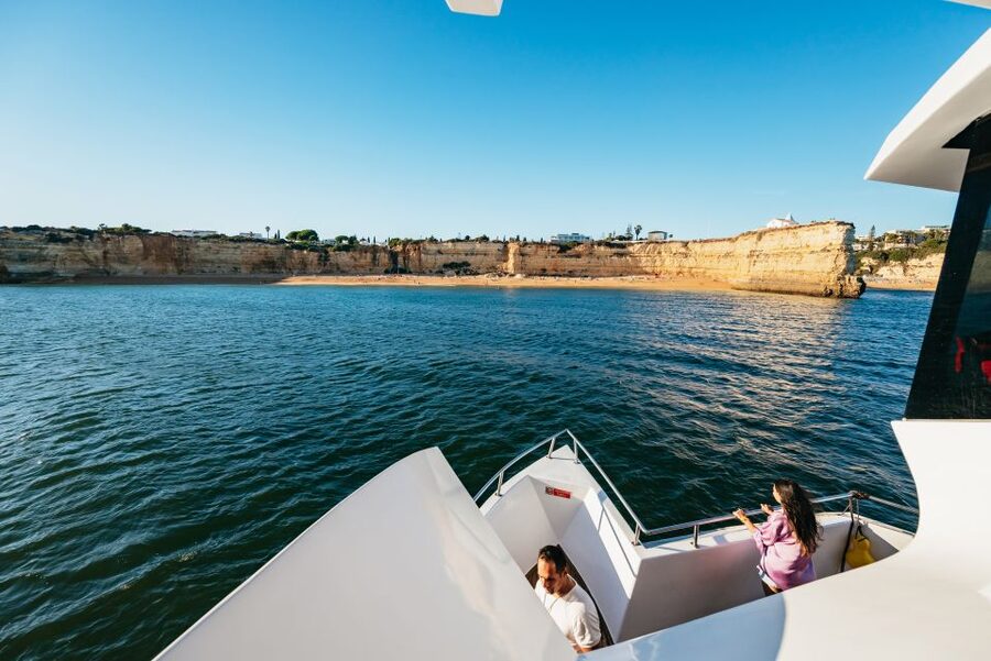 From Albufeira: Sunset Cruise and Beach BBQ with Open Bar - DJ, Live Commentary, and a Fire Performer at Night