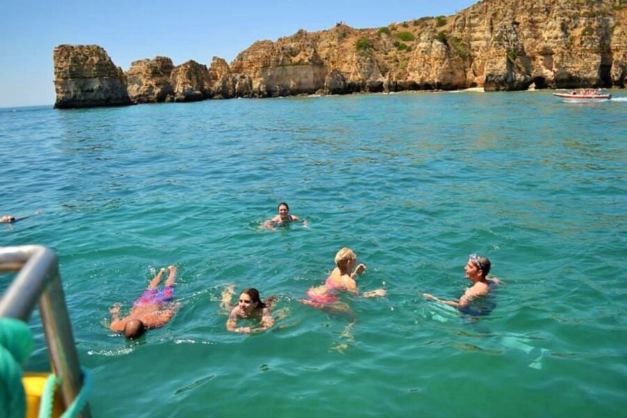 From Lagos: 2.5-Hour Guided Coastal Boat Tour & Grotto Visit - Swimming, Jumping, and the Aqua Trampoline Stop