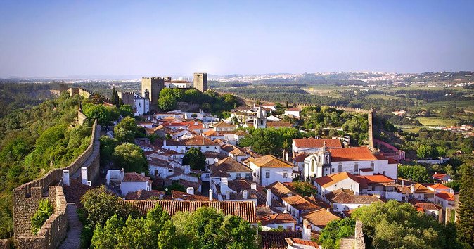 From Lisbon: Fátima, Nazaré, Batalha and Óbidos Guided Tour - Óbidos: the medieval-walled wandering that people remember