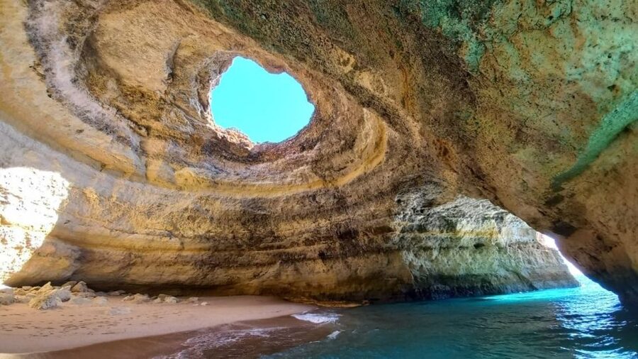 From Portimão: Algar de Benagil and Sea Caves Boat Tour - Praia da Marinha: your included beach stop, and what it’s for