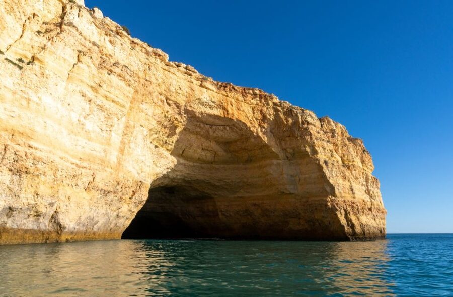 From Portimão: Benagil Sea Caves Boat Tour at Sunrise - Benagil Caves moment: sunlight, echo, and the sand below