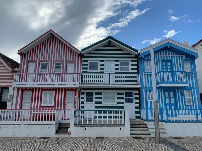 From Porto: Aveiro & Coimbra Tour with Moliceiro Boat Cruise - New Coast, Striped Houses, and Salt Pans You Pass Along the Way