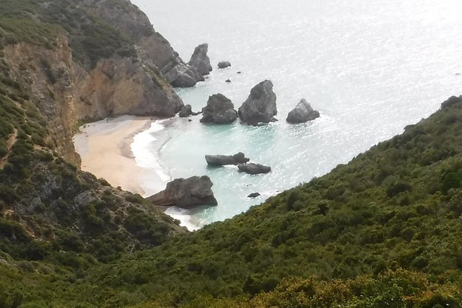 Kayak tour from Sesimbra to Ribeira do Cavalo Beach, passing through the caves - Included Toasted Flour Sweet From Sesimbra