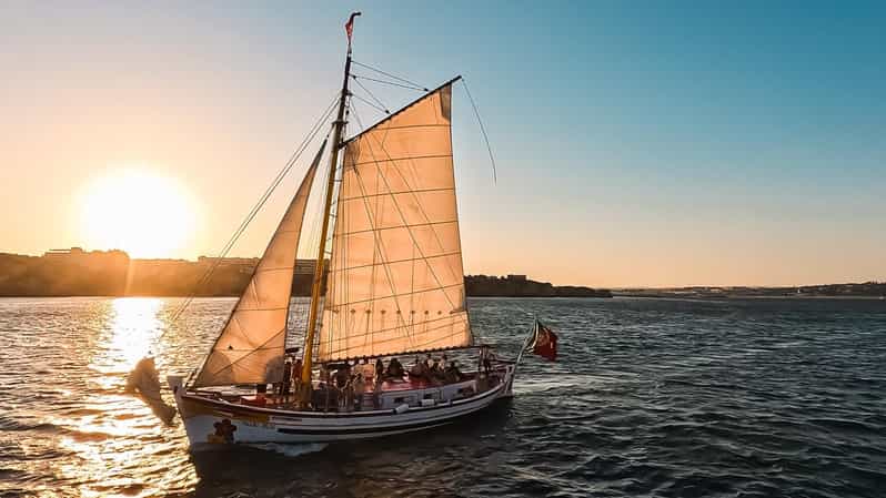 Lagos: Sunset Sail aboard a Traditional Boat with Prosecco - The traditional Portuguese sailing boat setup: comfort, seating, and windbreakers