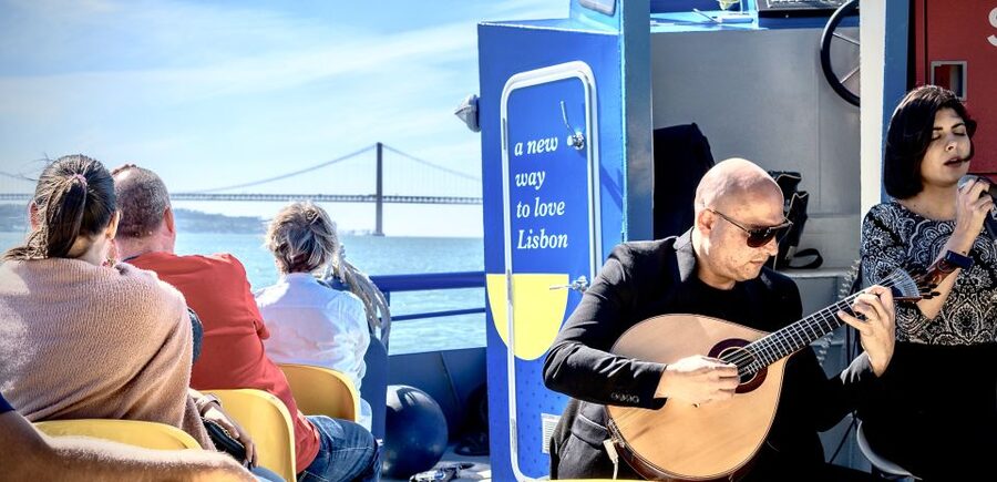 Lisbon: Boat Cruise with Live Fado Performance and a Drink - Views, wind, and photo tips for a small deck