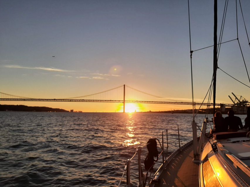 Lisbon: City Skyline Sailboat Cruise with Drink and Snacks - Praça do Comércio and the central city view from the water