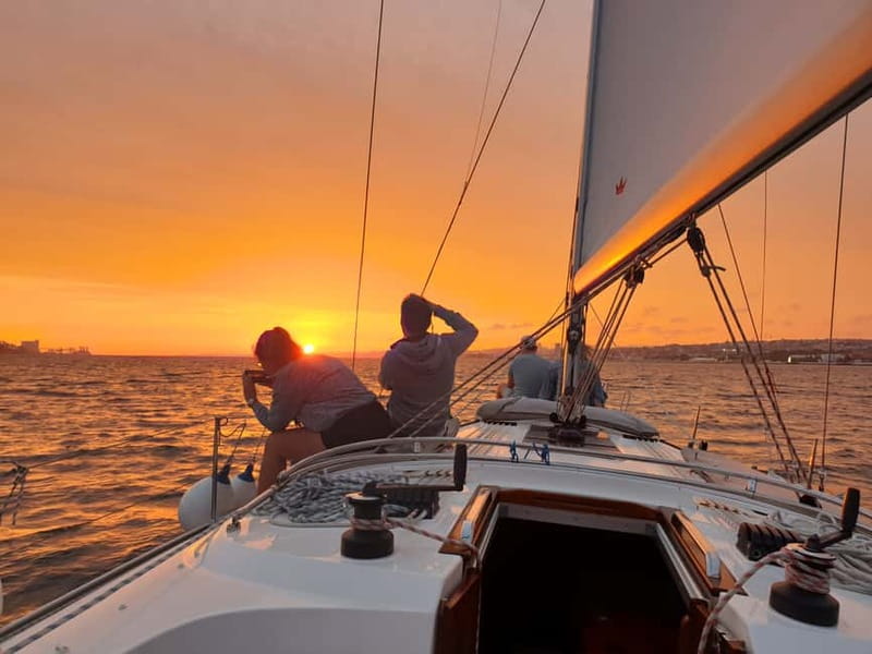 Lisbon: Daytime or Sunset Boat Cruise with History and Wine - When the lights come on: the best part of sunset sailing