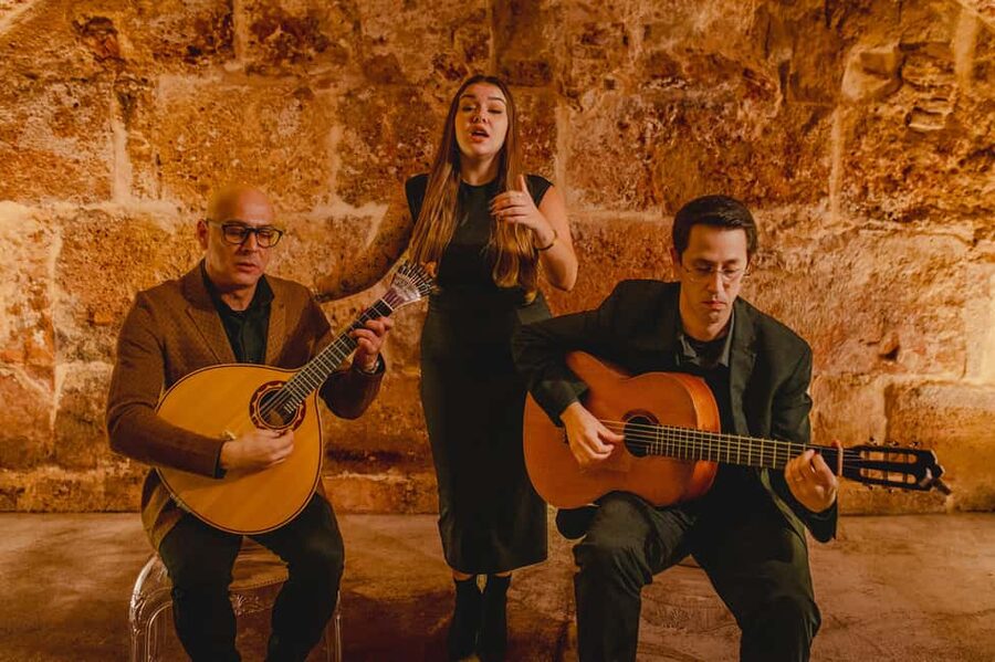 Lisbon: Fado Show with Wine in a Historic Venue - Lisbon’s medieval walls make Fado feel closer