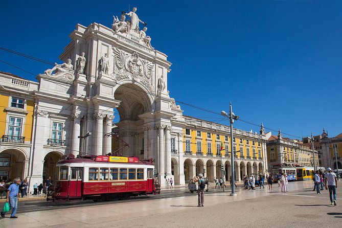 Lisbon Hills Red Tram by Tram 28 route - The XII Cent Monument stop: a pause for scale and time