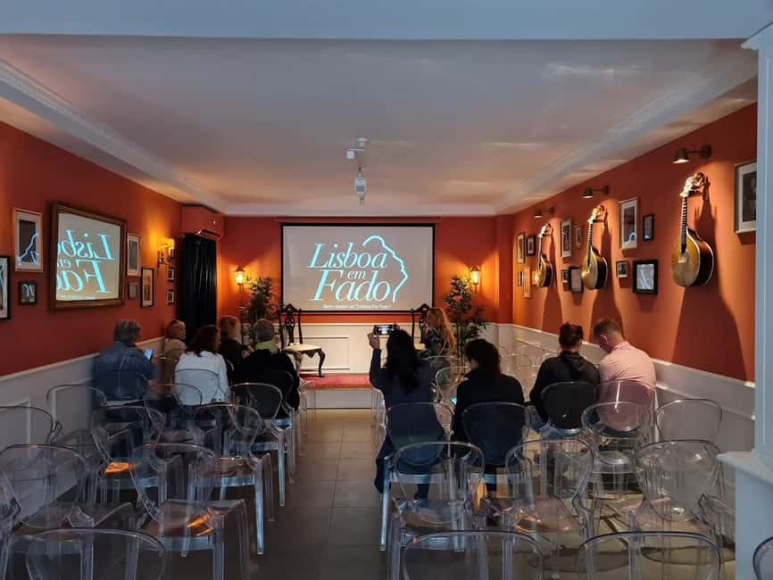 Lisbon: Live Fado Show with Port Wine in Historic Center - The show structure: songs plus context on video