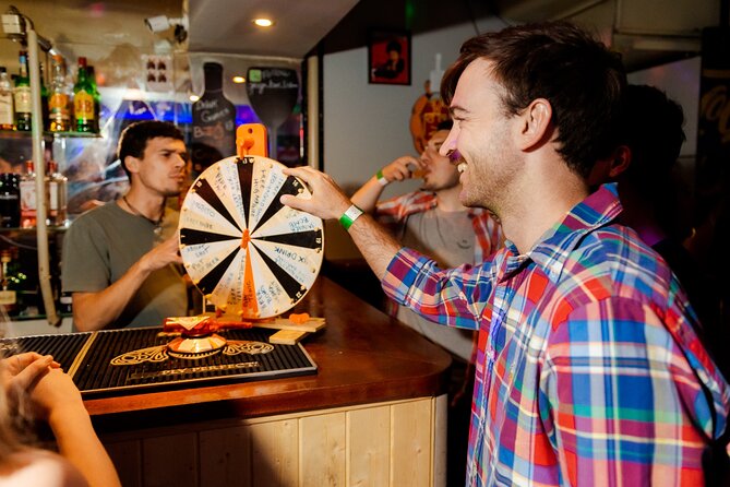 Lisbon: Pub Crawl with Open Bar, Shots & VIP Club Entry - Bica Funicular Open Bar Hour: Beer and Sangria, Plus How to Pace It