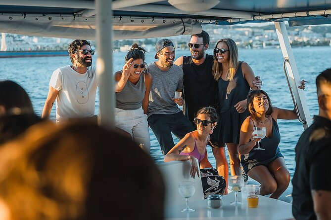 Lisbon: Sunset Catamaran Boat Tour with Music and Drinks - Music, drinks, and the social tone onboard