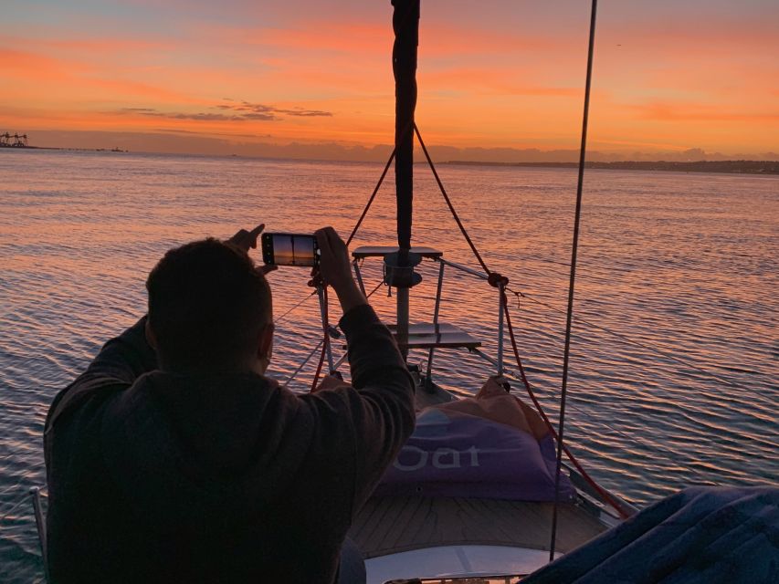 Lisbon: Sunset Sailing Cruise with Wine - Crew energy and on-the-water storytelling in English and Portuguese