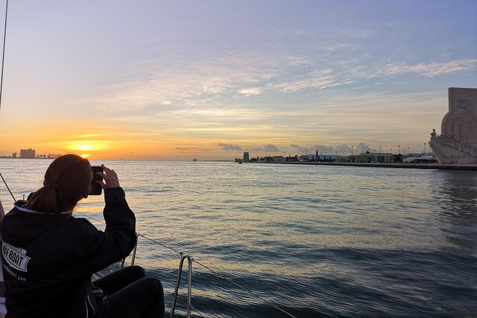 Lisbon Sunset Sailing Tour on Luxury Sailing Yacht with 2 Drinks - The halfway drink stop: 2 drinks and Portuguese cheese and chouriço