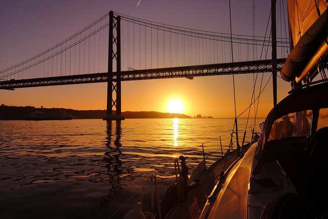 Lisbon Sunset Sailing Tour on Luxury Sailing Yacht with 2 Drinks - Best places to sit on the yacht for photos and comfort