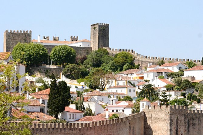 Lisbon to Porto Up To 5 Stops Óbidos Nazaré Fátima Coimbra Aveiro - Nazaré: Surf Legends, Fishing Traditions, and Atlantic Views