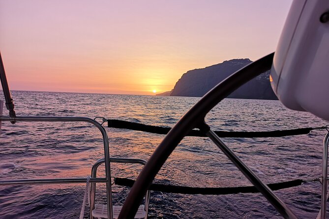 Madeira Private Sunset Boat Tour from Funchal - Passing Funchal oceanfront: cliffs, hotel estates, and city lights after dark