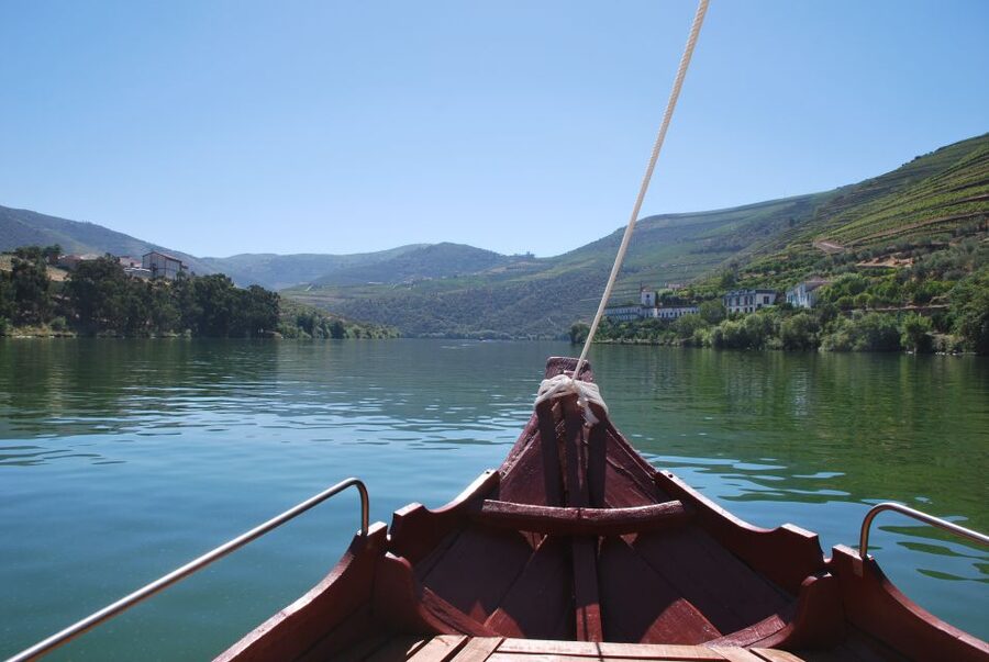 Pinhão: 2-Hour Rabelo Boat Tour with Audio Guide - Entering Pinhão by the iron bridge, then cruising into wine country