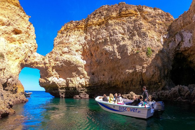 Ponta da Piedade Boat Tour to Caves and Beaches with Local Guide - The Lighthouse Moment: 1912 on old church grounds