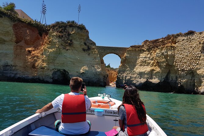 Ponta da Piedade Coastal Tour in Lagos, Algarve - Stop 2, Praia do Camilo: Wooden Steps, Shells in Stone, and a Tunnel Through Rock