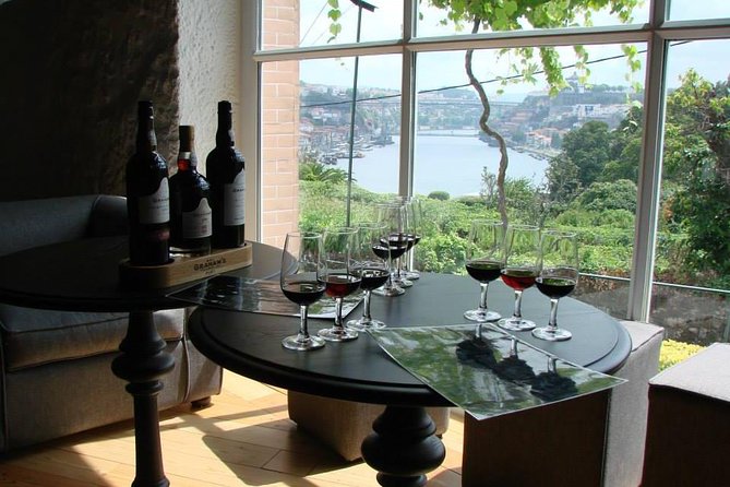 Porto Full Day City Tour Wine Tasting and Six Bridges Cruise - Vila Nova de Gaia port lodge tasting: three wines and real production context