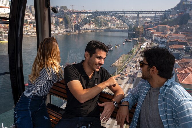 Porto Walking Tour, Lello Bookshop, River Cruise and Cable Car - Douro River cruise: Dom Luís I Bridge and Porto from the water