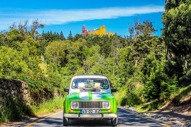 Private Local Sintra Tour: Palaces & Coast by Classic Car or Jeep - Stop 1 in Sintra: Pena Palace area, Moorish past, Fonte da Sabuga, and Chalet Biester
