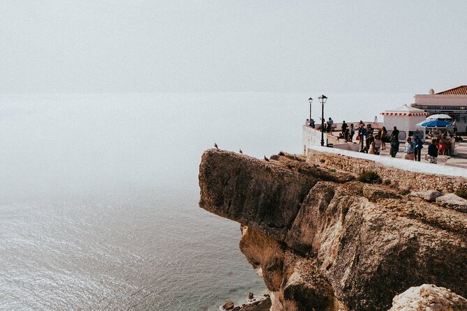 Tour from Lisbon: Obidos, Nazaré and Fátima Small Group - Nazaré: Praia do Norte waves, the Lighthouse story, and seafood lunch time