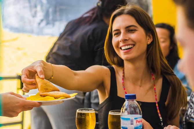 Winner 2025 Undiscovered Lisbon Food & Wine Tour by Eating Europe - Moorish Lisbon street views, ginjinha, and Portugal’s pork-and-beer comfort stop