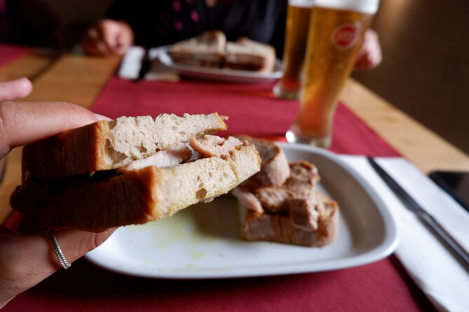Winner 2025 Undiscovered Lisbon Food & Wine Tour by Eating Europe - Mouraria murals, photo moments at an old major church, and VIP Fado House tastings